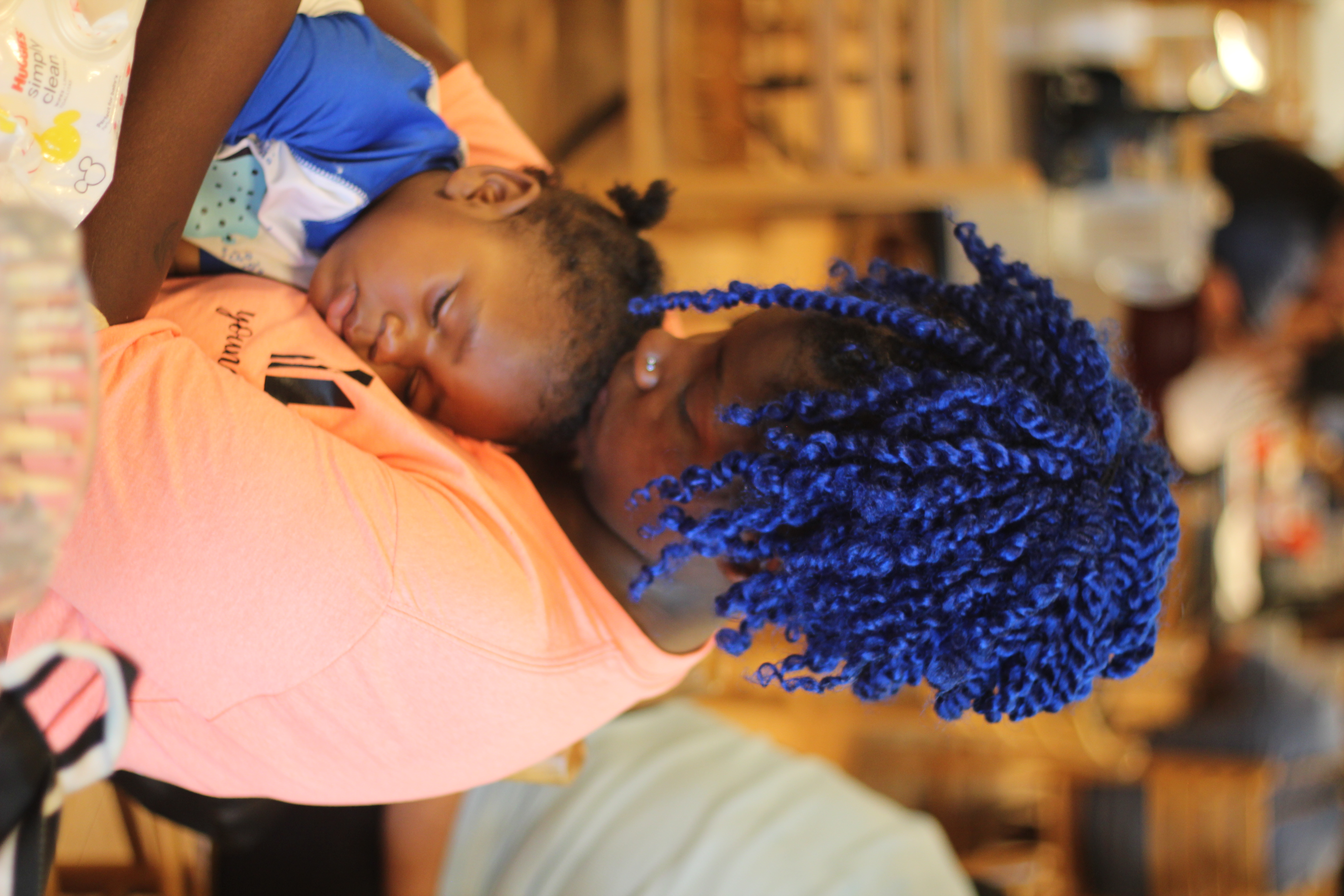 A teen mom smiling with her baby